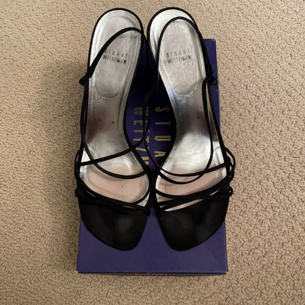 Stuart Weitzman black strappy heels.
